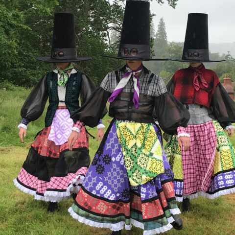 3 people in elaborate costumes