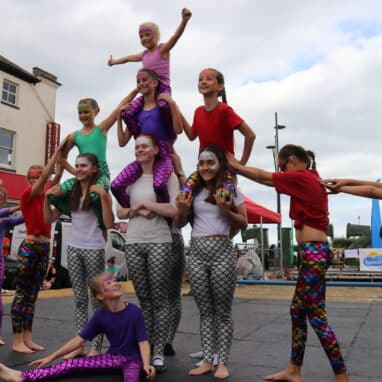 Students of the Drillaz Circus School performing a human triangle