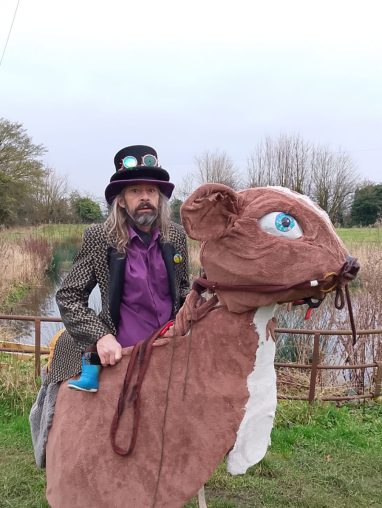 Man riding a giant hamster