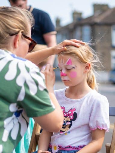 Child being face painted