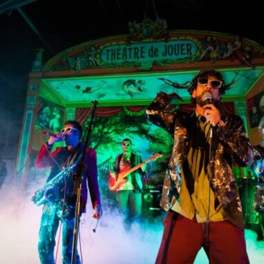 Band performing onstage at the Drill House