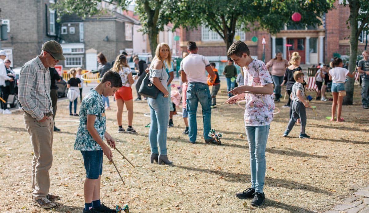 Boys practice diablo in the park