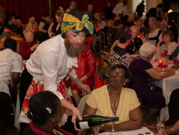 Timberlina a bearded woman serving customers at Posh Club