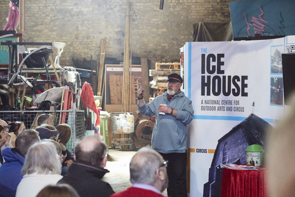 Tour guide giving a talk on The Ice House in great yarmouth to a guide