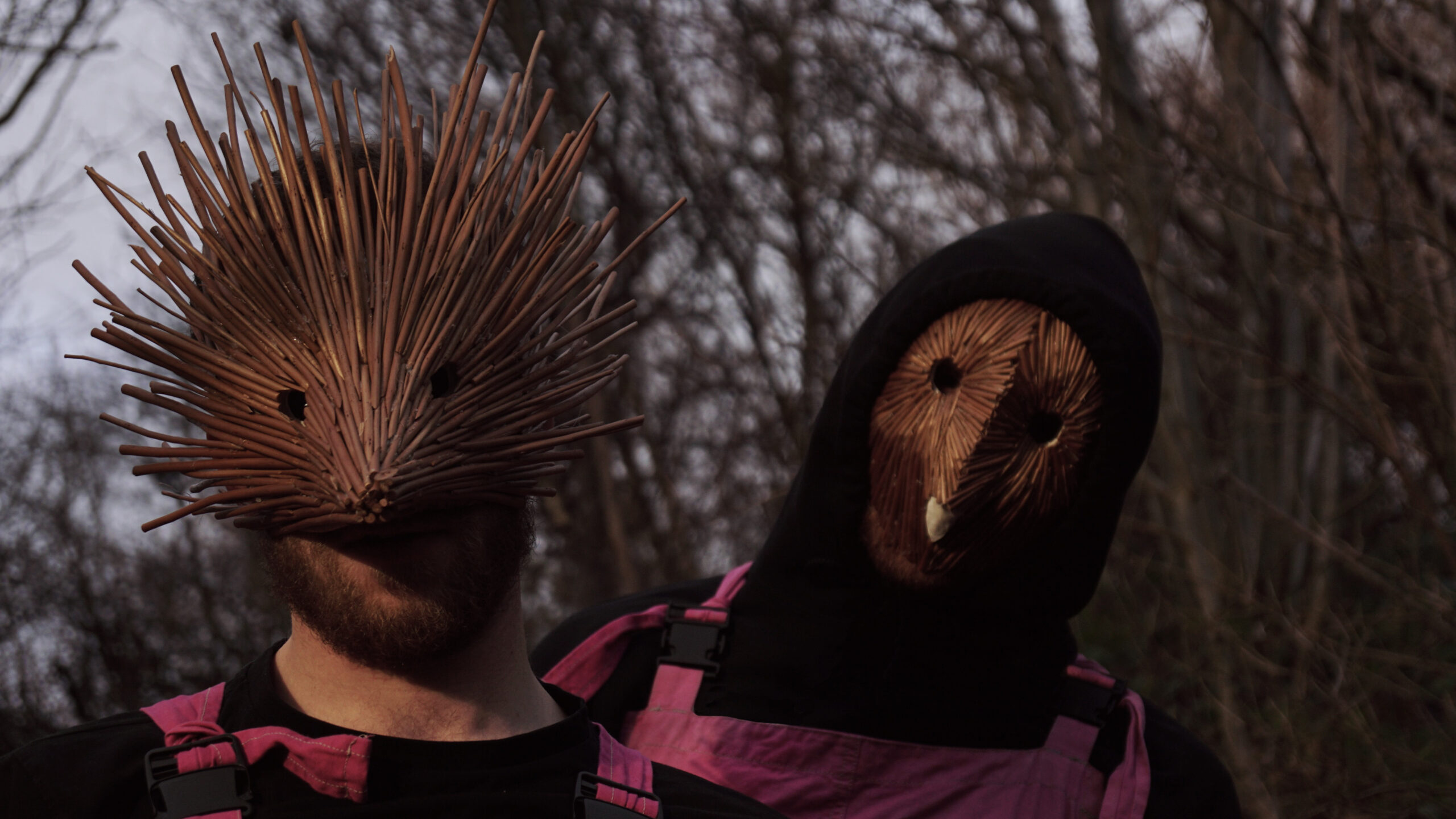 Two Performers in brown masks