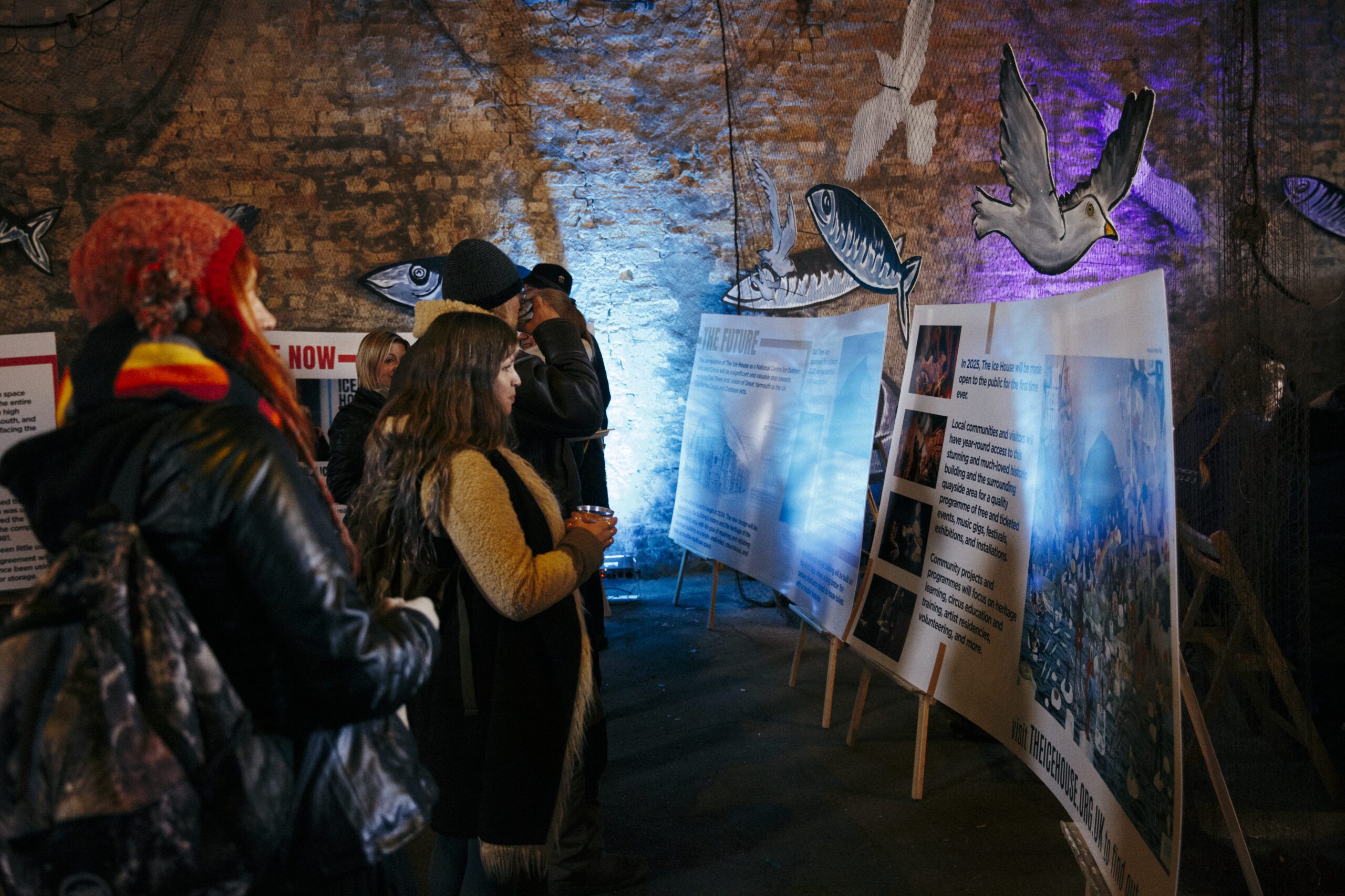 Visitors to The Ice House browsing heritage information