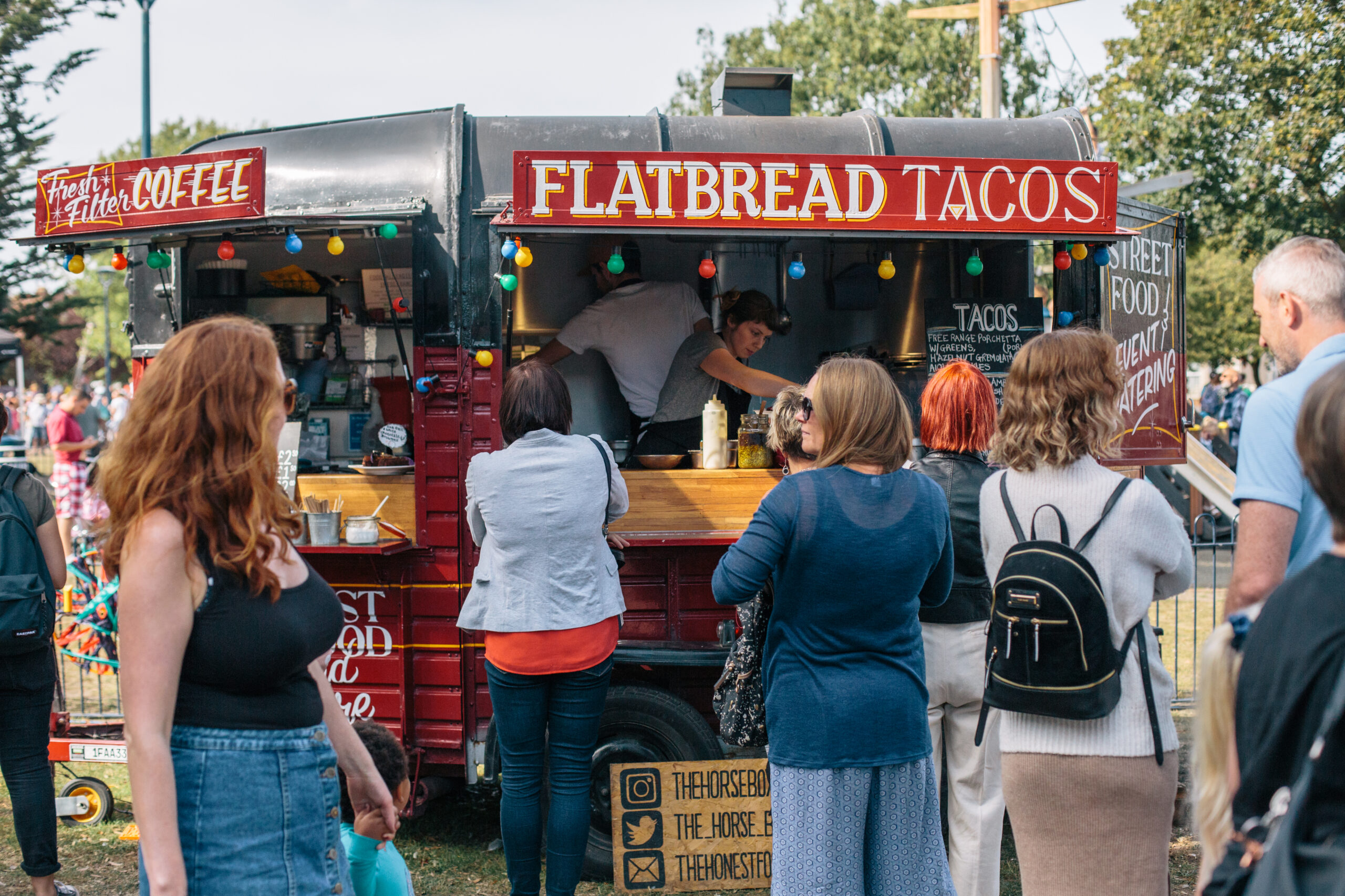 Out There Festival Goers enjoying food from a food stand in Great Yarmouth