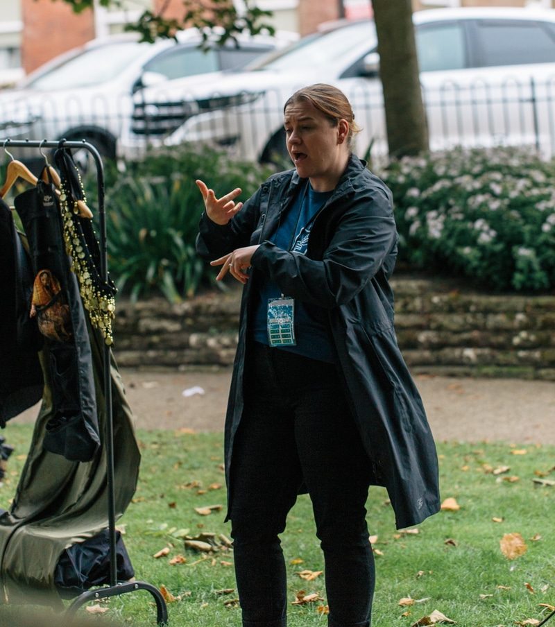 A sign language interpreter gestures.