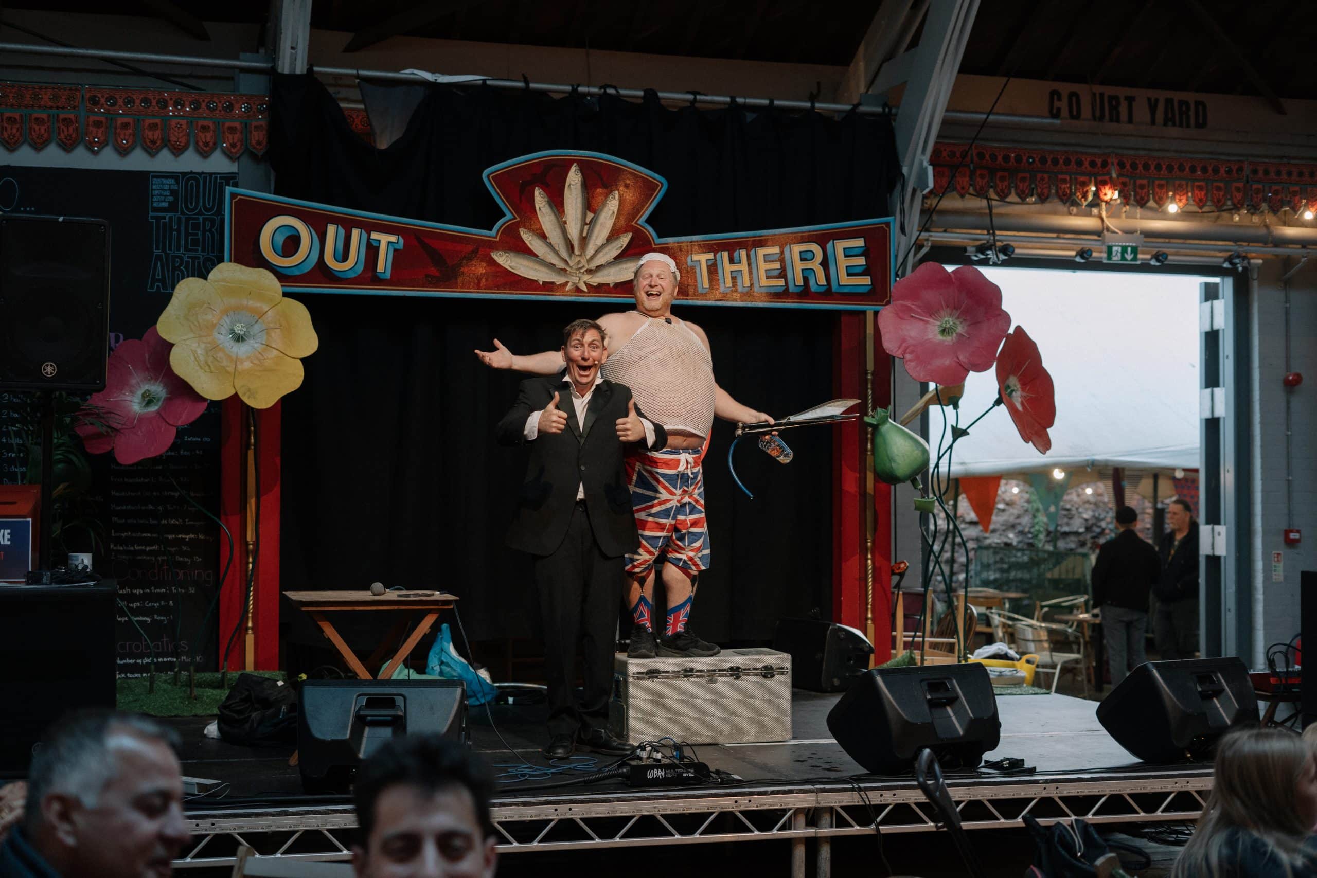 Two male performers on a stage