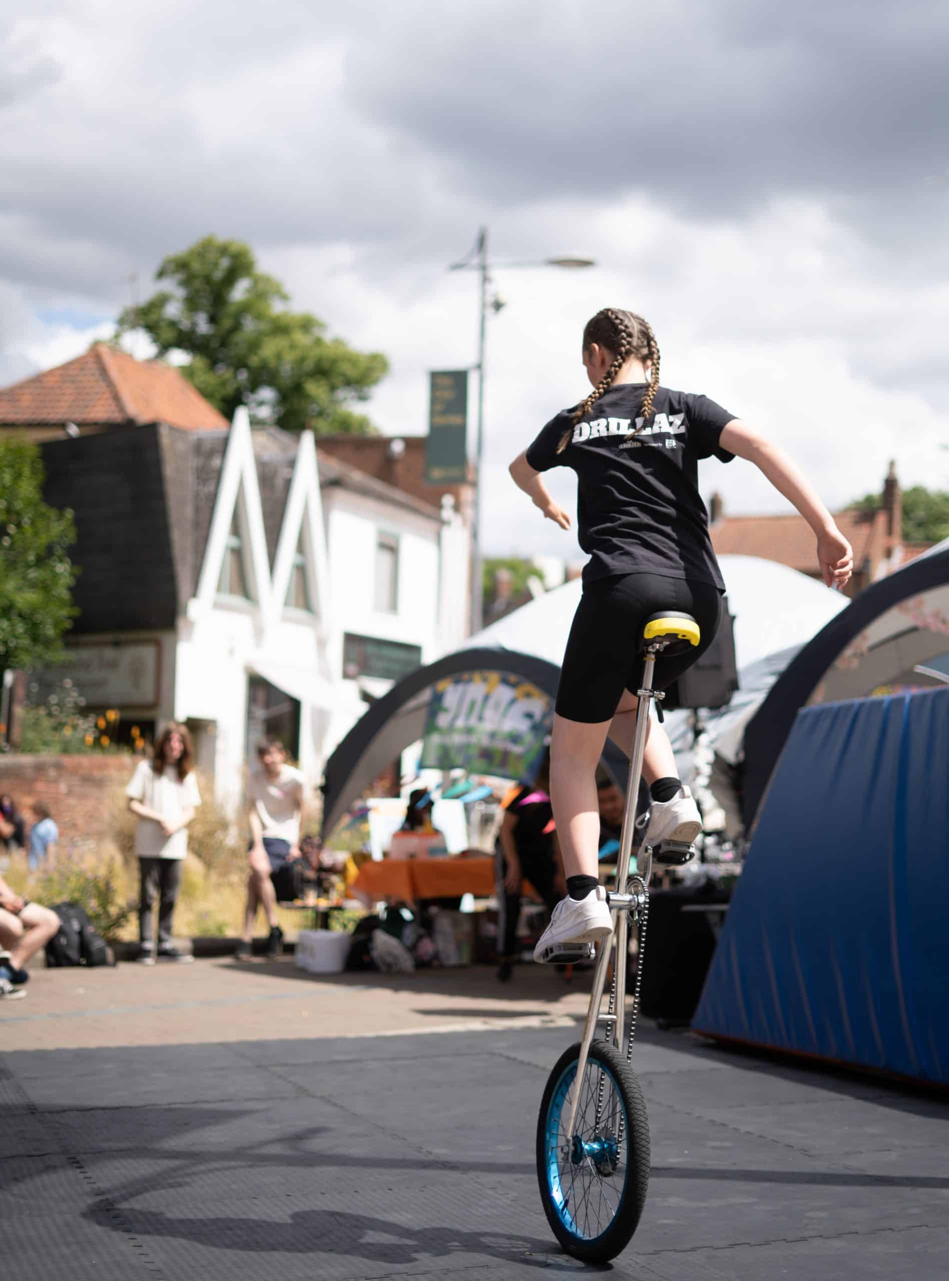 Girl on unicycle