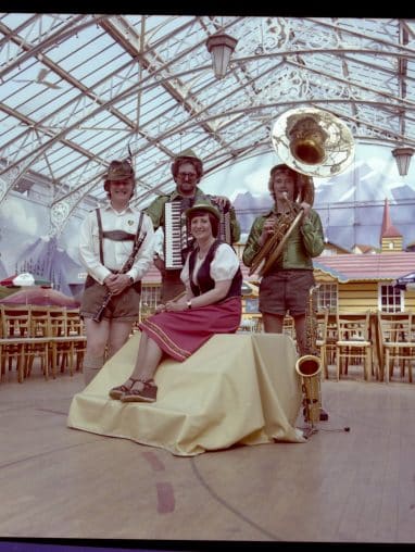 People dressed up in lederhosen in the winter gardens