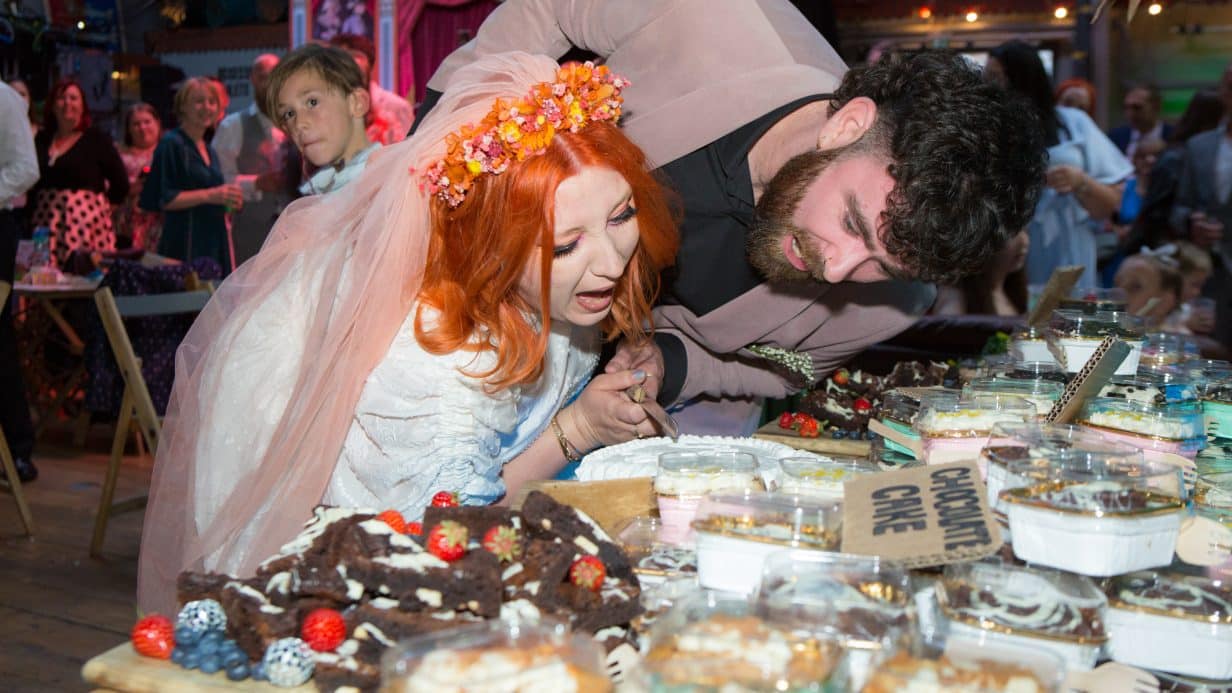 Bride and groom cutting the cake