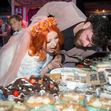 Bride and groom cutting the cake