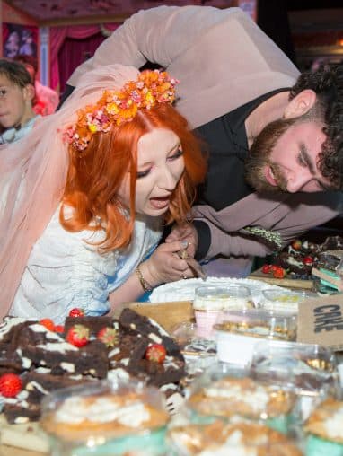 Bride and groom cutting the cake