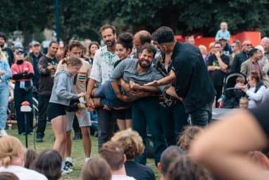 Man being carried by a crowd at Out There Festival