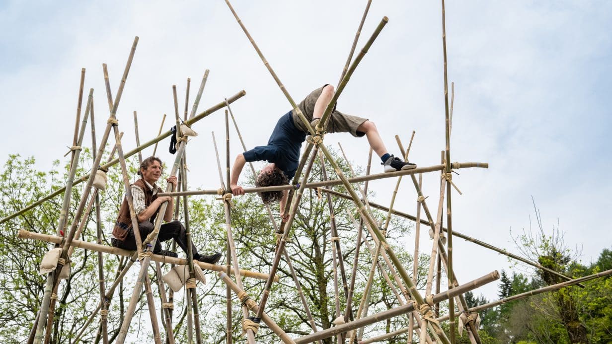 Acrobats climbing bamboo