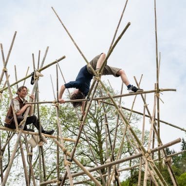 Acrobats climbing bamboo