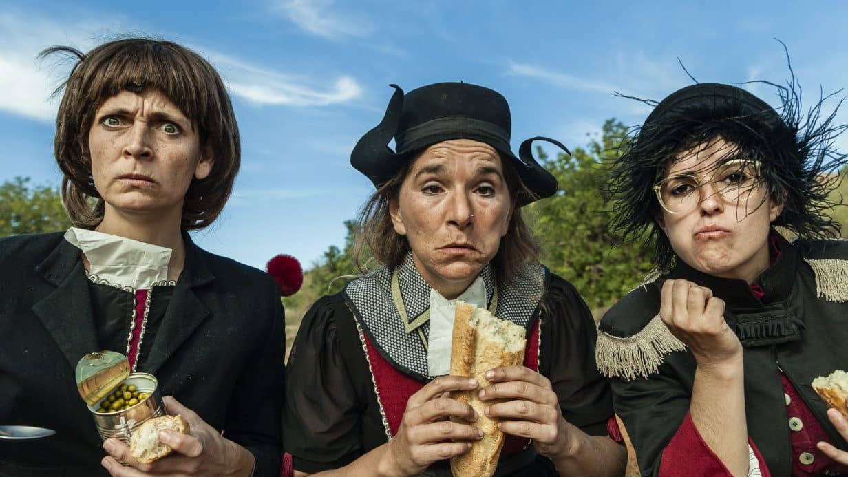 three women eating and making funny faces