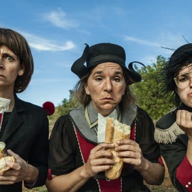 three women eating and making funny faces