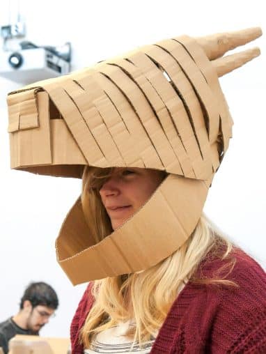 pexels-roxanne-minnish-2936023-7963153 Girl wearing cardboard animal mask
