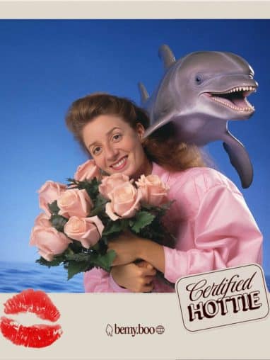 Lady holding flowers with dolphin in background