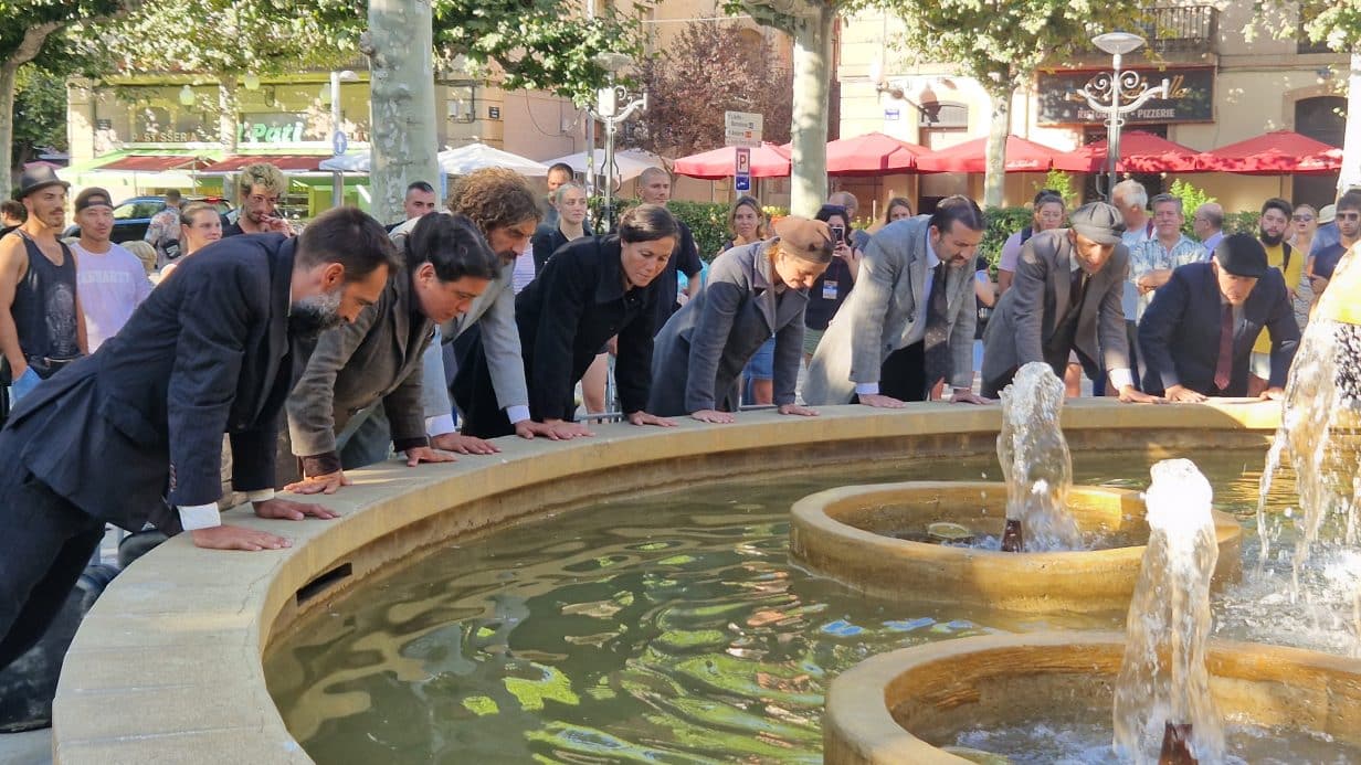 People looking into a fountain