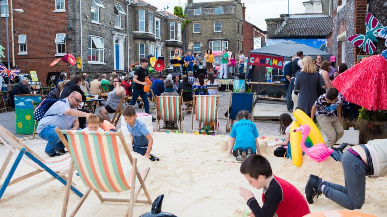 Deck chairs and sand on a street