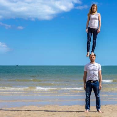 Lady standing on man