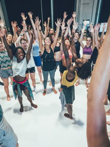 alleyne dance Crowd of people with their hands in the air
