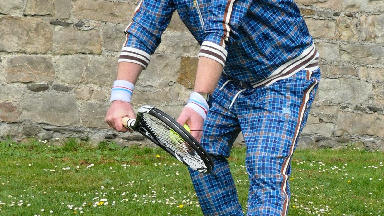 P1050812 Man in tennis gear with tennis racket