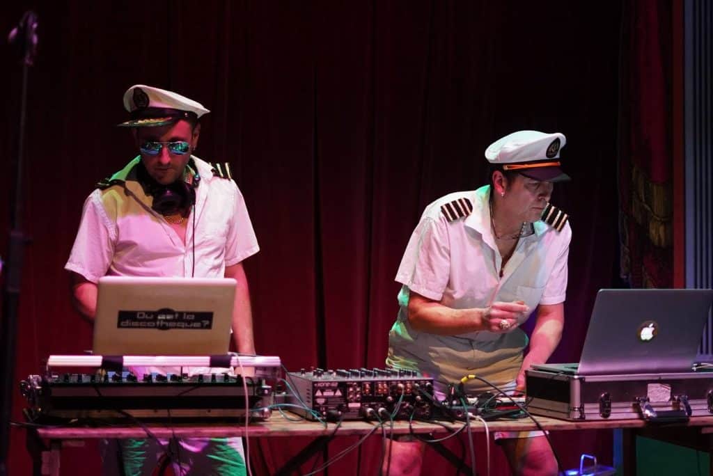 two djs dressed as sailors
