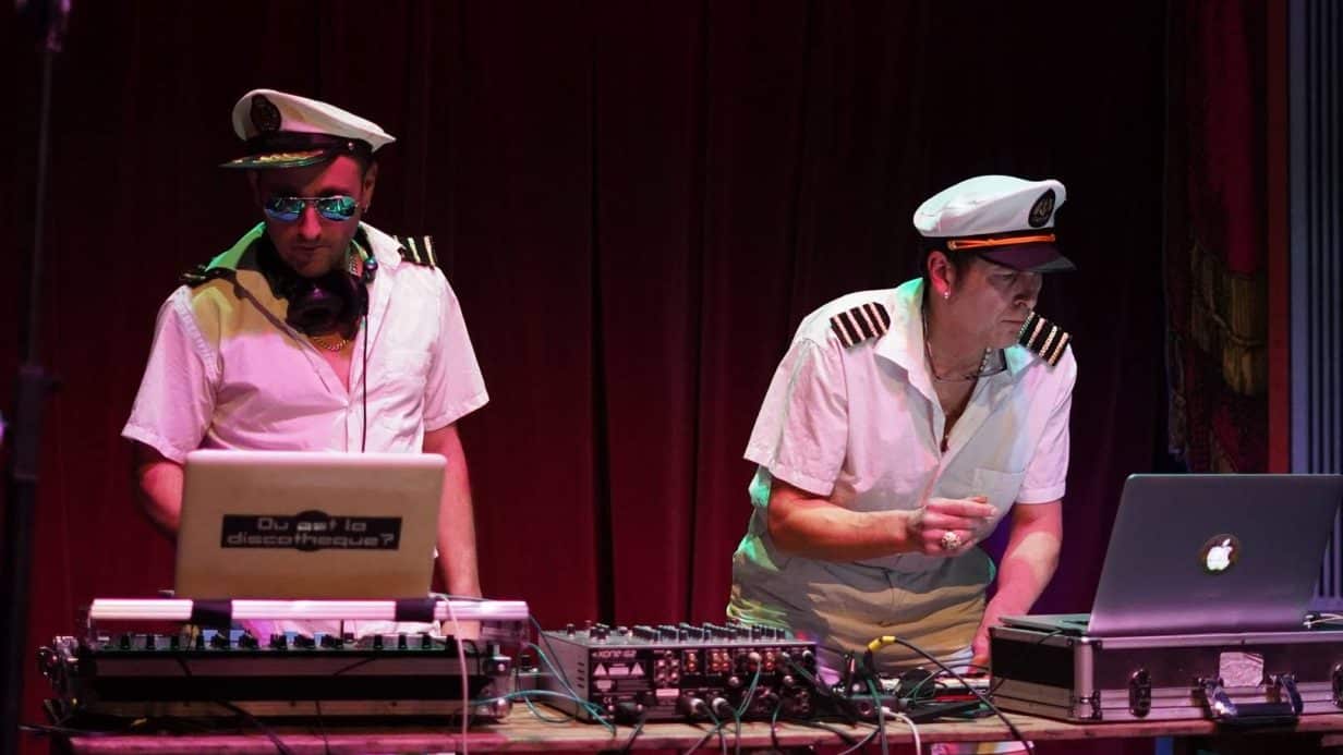 two djs dressed as sailors