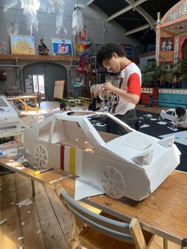 IMG_6777 Boy making a car out of cardboard